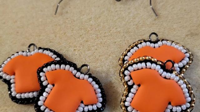 Photo of orange shirt earrings by Silver & Ivy Beads