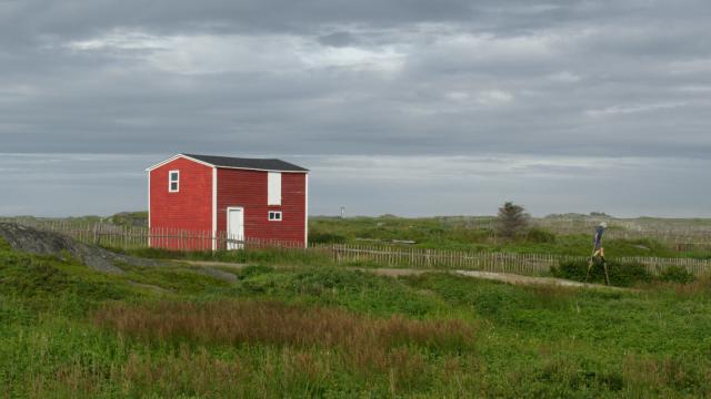 Red building and child on stilts