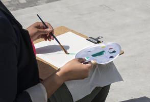 Employee painting using water colour