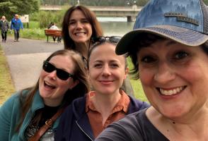 The members of the Silvana Quartet are outdoors taking a selfie in Banff National Park