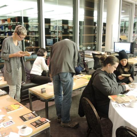 Participants browsing materials for inspiration into making their own deck