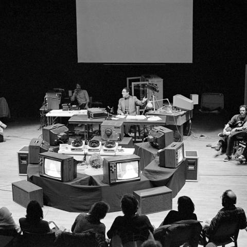 Archival photo of a workshop on stage of the Eric Harvie Theatre