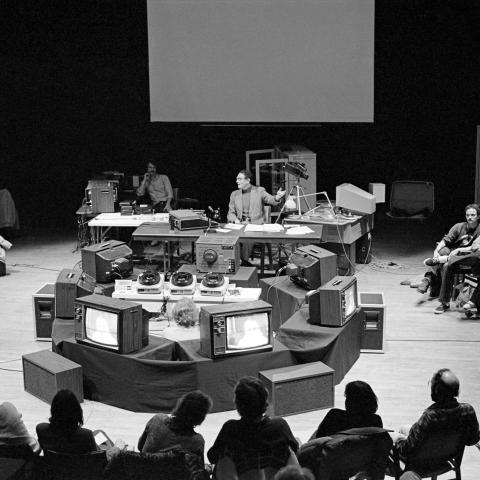 Archival photo of a workshop on stage of the Eric Harvie Theatre