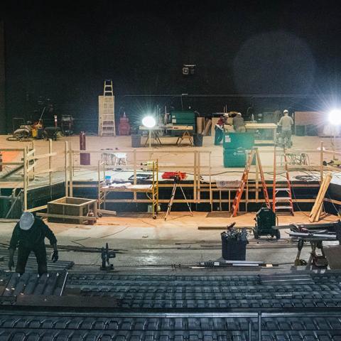 Construction workers assemble the new theatre. 