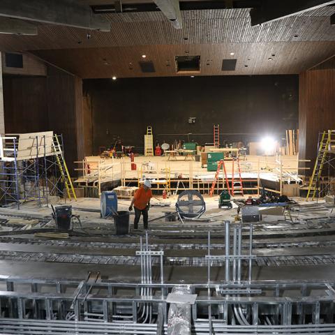 Workers re structure the layout of the theatre. 