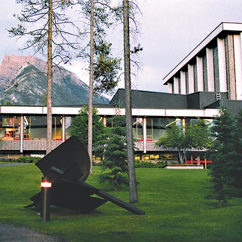 Archival shot of the Eric Harvie Theatre at dusk. 