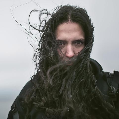 Man with long hair in the wind