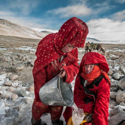 2 Afghan Krygyz women collecting water © Beth Wald