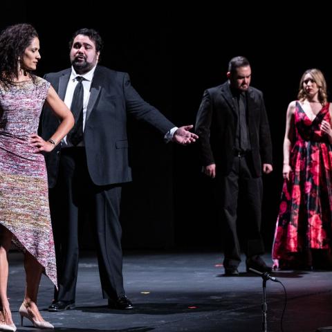 four opera singers perform onstage