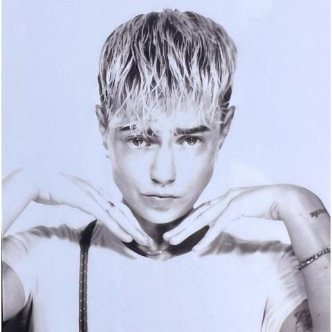person with short blond hair