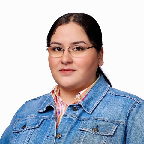 Women with long hair wearing glasses and jean jacket