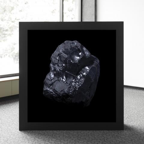 A black light box with an image of a rock sits in the corner of the room. 