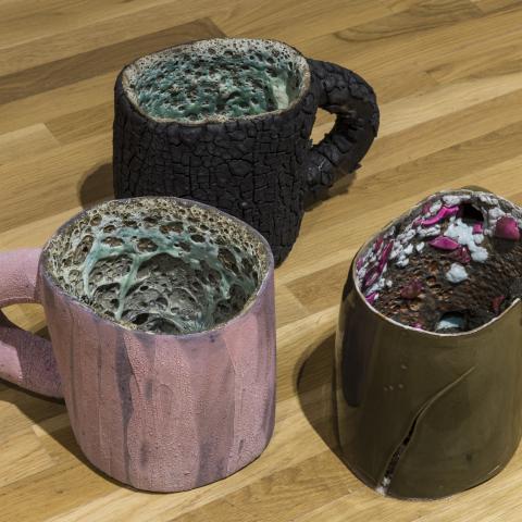 Patrick Jackson, "Burnt Bubbles; Pink Crack with Barnacles; Broken Mug" (2014). 8.5” x 8.5” x 13” (each). Ceramics and mixed media. Walter Phillips Gallery, Banff Centre. Photograph by Rita Taylor.