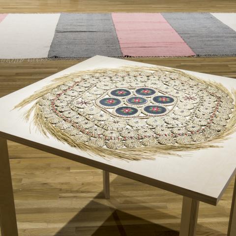 Rebecca Baird, installation view of "Memory Claim #1" (1995). Sweetgrass, hide, porcupine quills, seed beads, abalone buttons. 81cm (diameter). Collection of the Walter Phillips Gallery, The Banff Centre. Photograph by Rita Taylor.