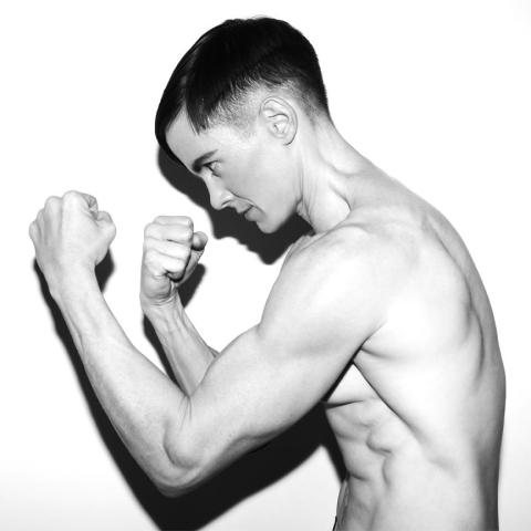 Photo of program faculty, Cassils, in profile boxer pose