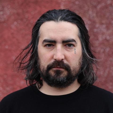 Men with long hair wearing black