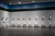 Art installation with chairs and screens