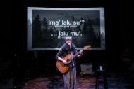 Mauna Delau playing guitar at Wîchoîe Ahiya Concert Participant Concert, 2023, photo by Rita Taylor.