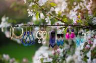Beaded earrings hanging from a branch