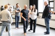 A group of people are rehearsing a play