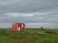 Red building and child on stilts
