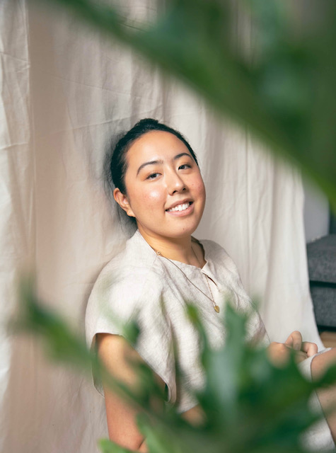 Photo of woman through plant leaves